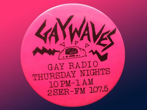 A round hot pink badge that says 'Gaywaves' on it.