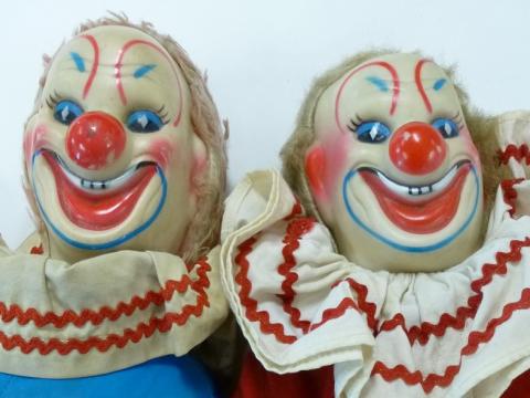 Bobo the Clown dolls complete with clown makeup and ruffles around their necks.
