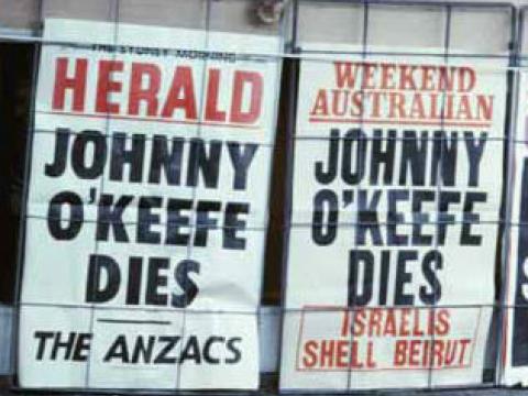 Newspaper billboards announcing death of Johnny O'Keefe 