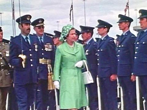The Queen arrives in Australia in 1977 and inspects a line up of military personnel