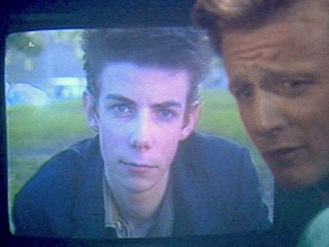 Noah Taylor in an early screen role in an educational video. He is on a television screen which is being watched by his friend.