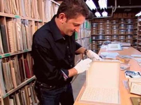 Warren Brown looks at an original sheet music manuscript for Waltzing Matilda at the National Library of Australia.