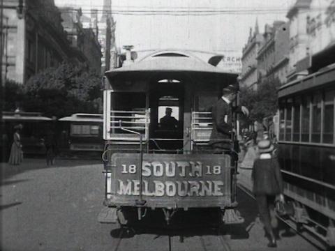 Black and white still of the back of a number 18 South Melbourne tram in the 1910s.