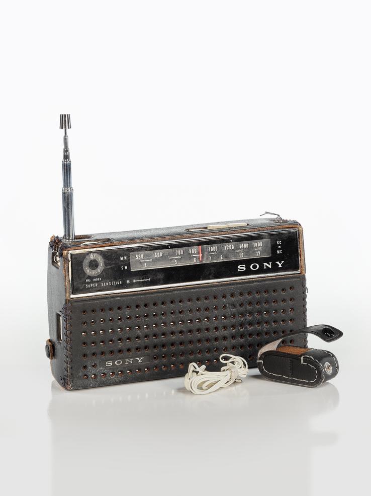 A portable Sony brand radio receiver.