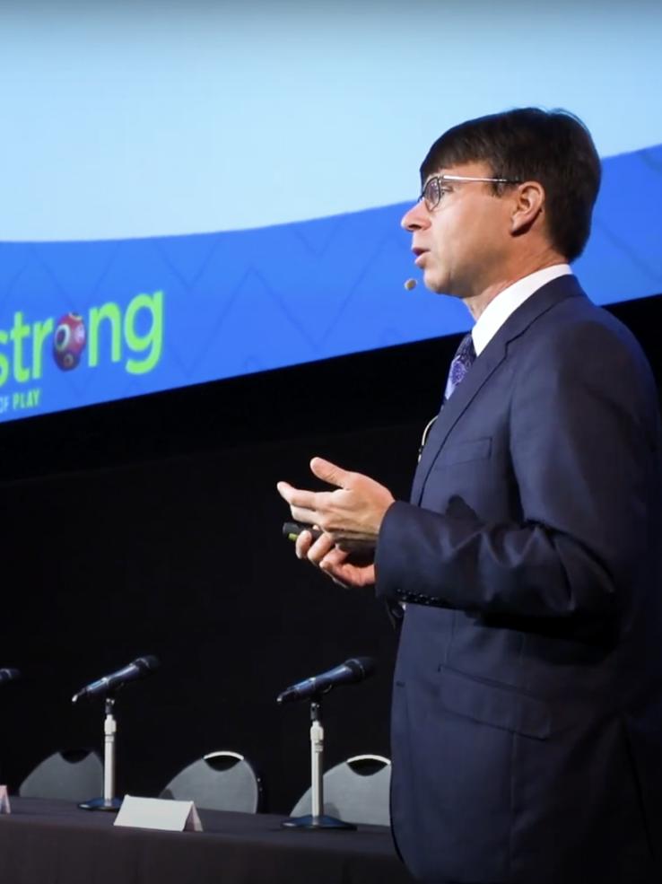 Jon-Paul Dyson from the Strong National Museum of Play speaking in front of a presentation