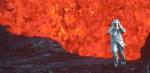 A person in a full body fire-protective suit walking near a volcano. You can see lava in the background.