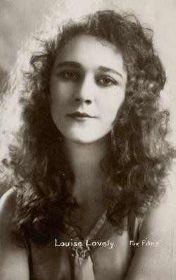 Head and shoulders Fox Films formal portrait of Louise Lovely with long wavy hair