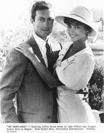 Black and white photo of Bryan Brown and Rachel Ward on the set of The Thorn Birds