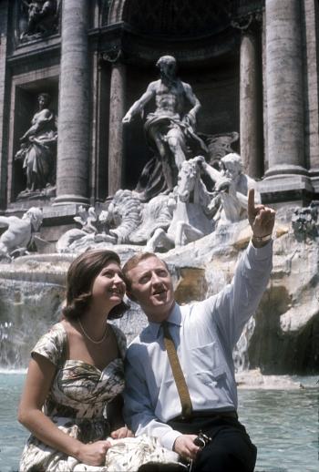 Graham Kennedy with Silvana Alliotti sittingon the edge of the Trevi Fountain, Rome