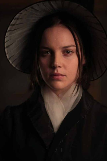 A still from Bright Star of actor Abbie Cornish, dressed in period costume. She is staring powerfully at the viewer.