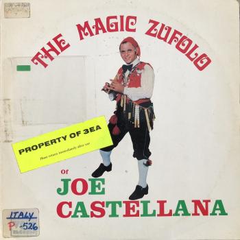 A man in Sicilian folk costume playing a wooden flute. Text reads, The Magic Zufolo of Joe Castellana