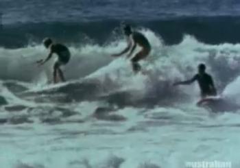 Three people surfing