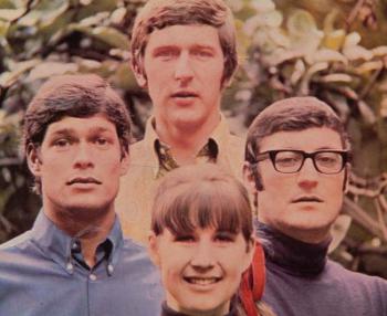 The Seekers looking at the camera in a still from an album cover.