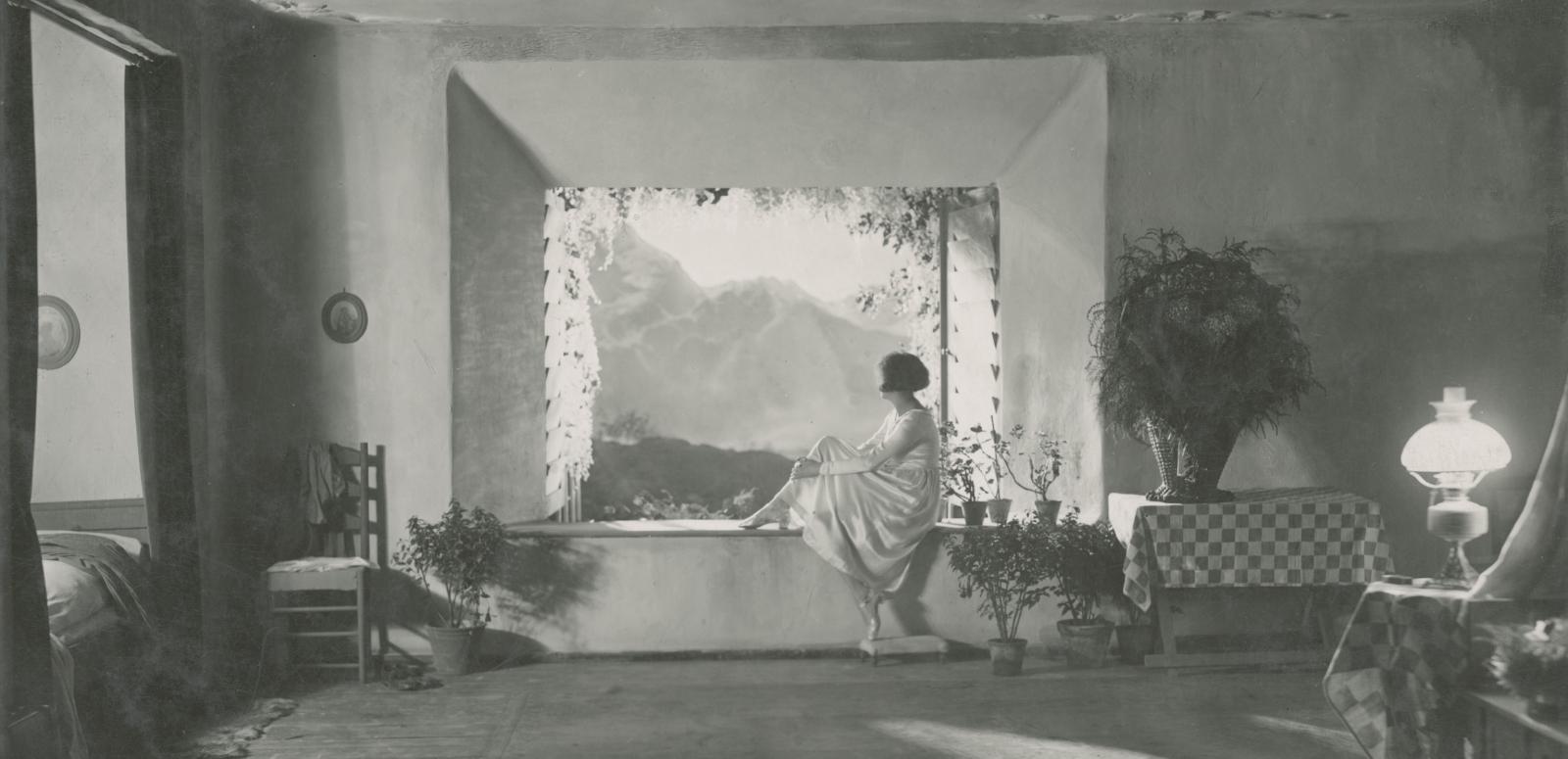 Leni Riefenstahl sits looking out the window in a still from the German film Der Heilige Berg, 1926.