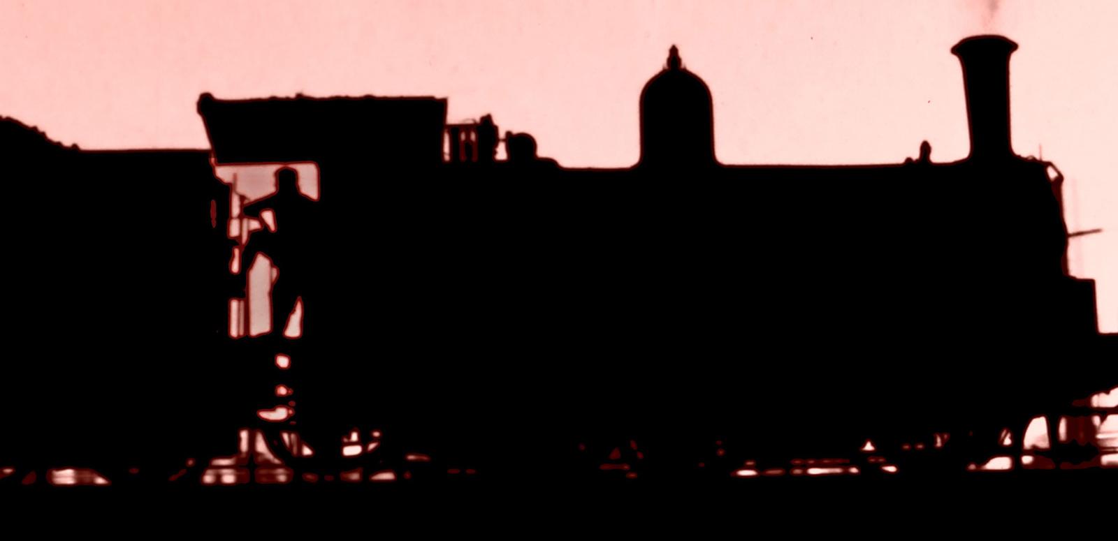 Silhouette of a steam train against a pink tinted background.