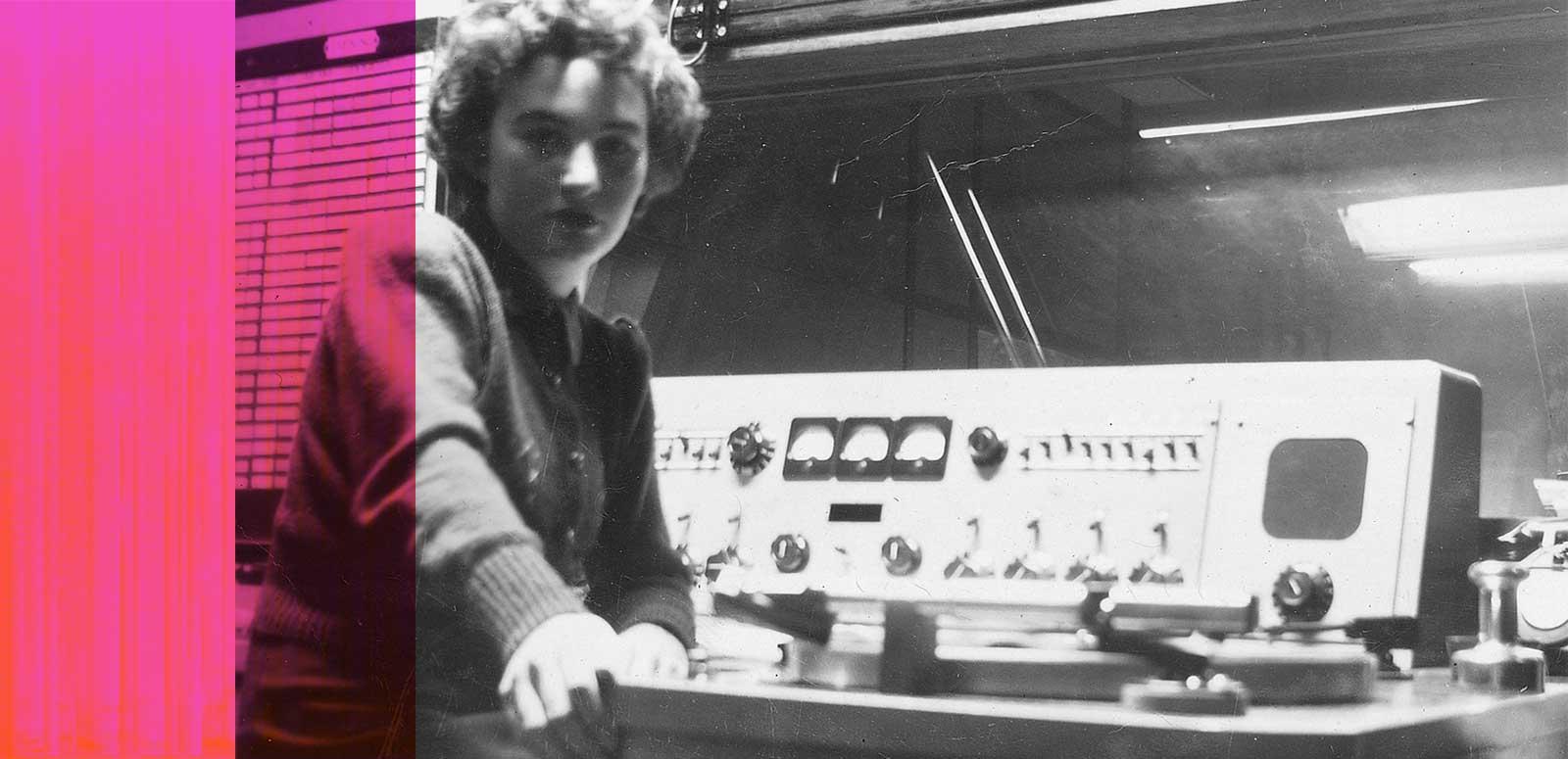 Radio personality Nina Valentine at a mixing desk in a radio studio