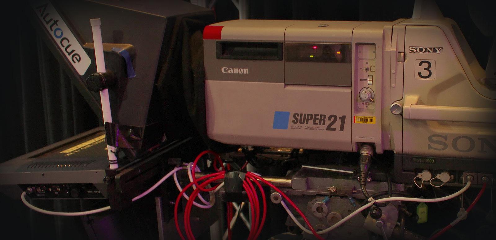 Close up of studio camera equipment, showing a Super 21 camera and autocue machine.