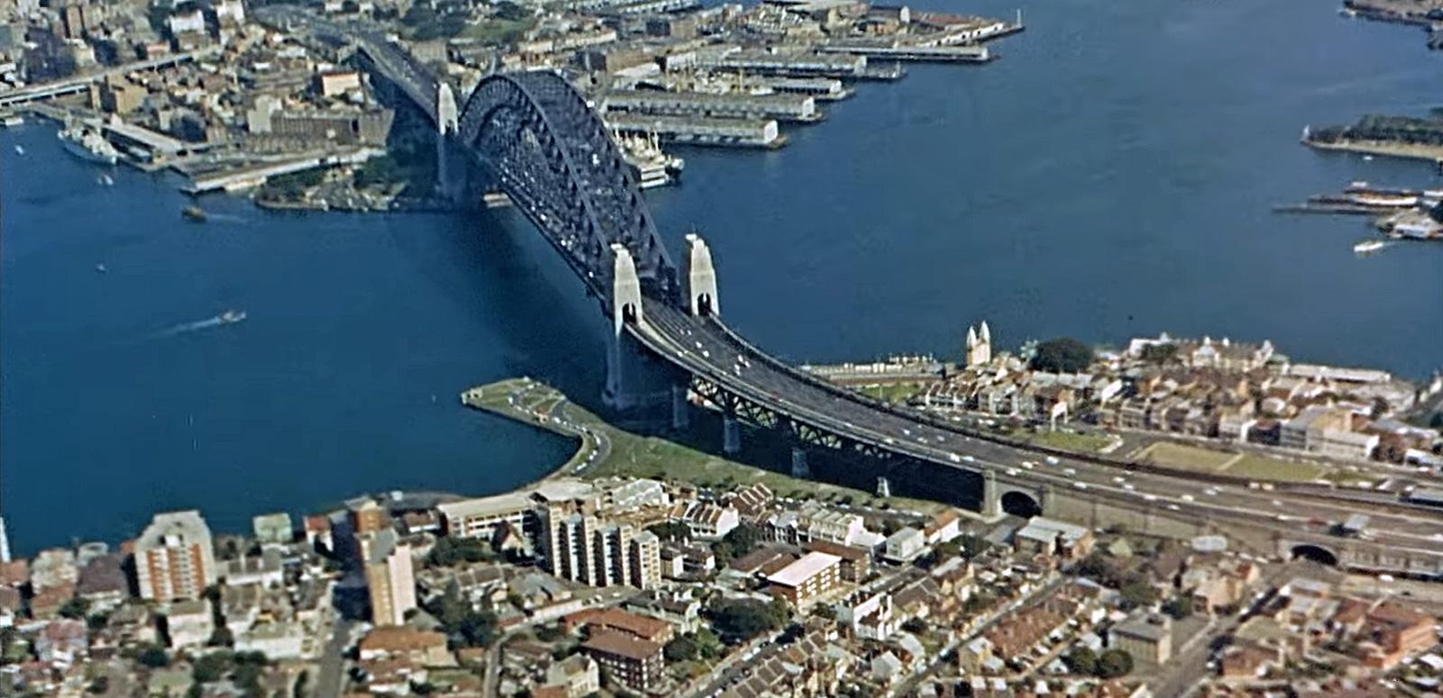 Aerial view of Sydney Harbour Bridge with Kirribilli and Milsons Point in the foreground and the Walsh Bay and Rocks area at the top of the image