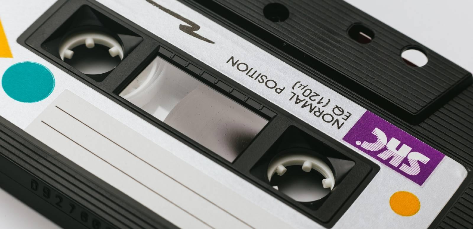 Close-up of a cassette tape with a blank label