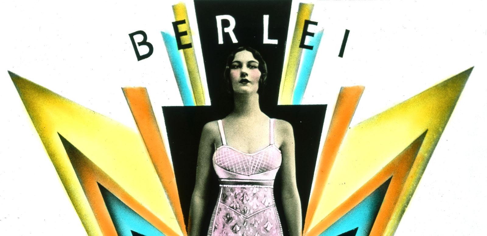 A woman wearing a pink foundation garment stands amidst art deco design elements suggesting power and lightening.