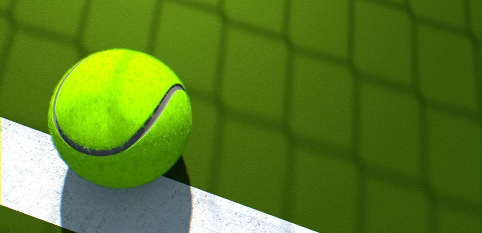 Close up of a tennis ball on a tennis court.