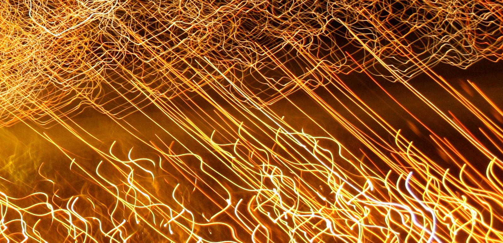 A long exposure image of lights. They have left trails across the image.