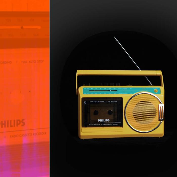 A bright yellow portable radio and cassette player