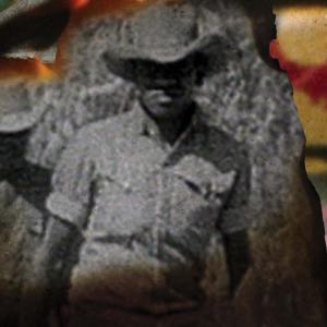 Detail from the poster for the film WINHANGANHA showing an archival photo of two First Nations men wearing collared shirts and bush hats. The edges of the black-and-white photo is curled up as if on fire, and the collage also features fire and the red, yellow and black colours of the Aboriginal flag