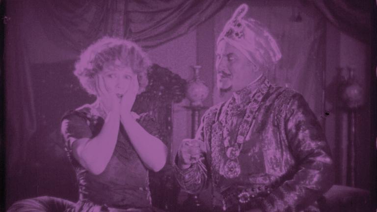 Frame capture from the 1924 film Three Days to Live showing a turbaned man next to a startled woman