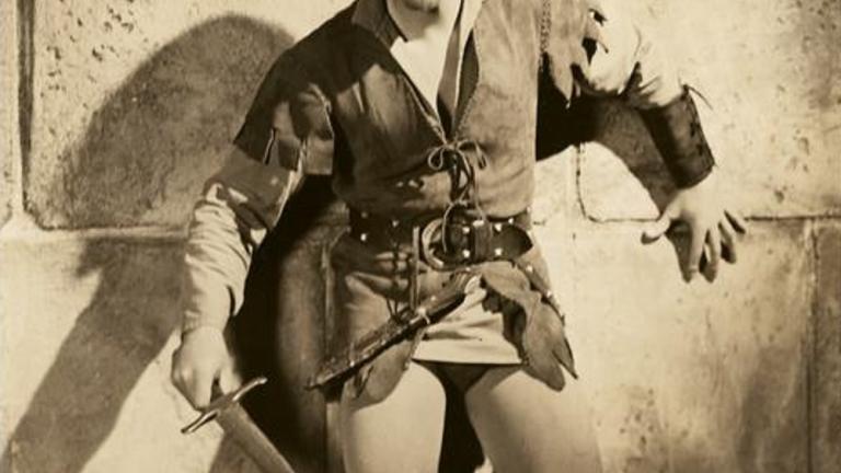 Errol Flynn with sword drawn
