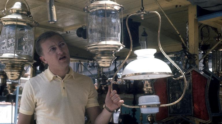 Graham Kennedy examines a lantern in a shop in Rome, Italy