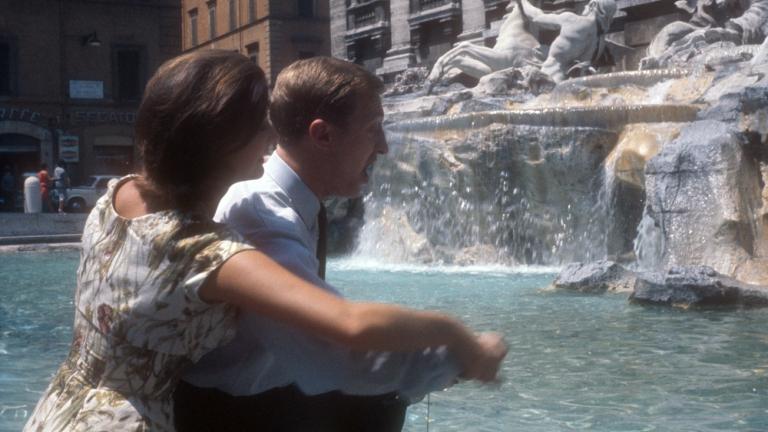 Graham Kennedy and Silvana Alliotti toss coins in the Trevi Fountain, Rome, Italy