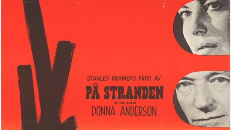 Sunset-coloured poster 'Pa Stranden'. Image depicts a submarine and black vertical shape near bottom left with black and white images of the film cast in a column at right. Printed signature 'ABERG' at bottom left. 