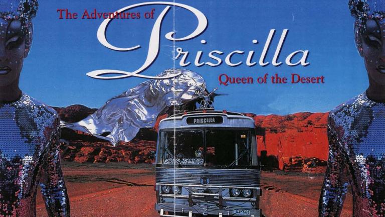 Image of bus travelling in desert setting with a drag queen riding on top dressed in a silver, flowing costume. Image is bordered by two drag queens dressed in silver sequined costumes and headresses.