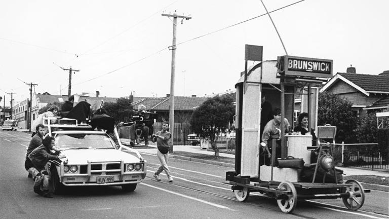 The crew film Malcolm, Judith and Frank riding in Malcolm's DIY mini tram