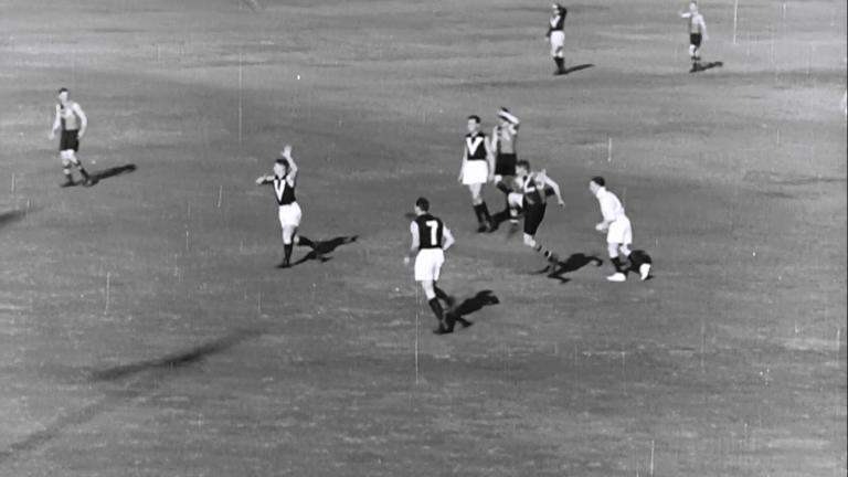 Sallis kicking in an AFL match
