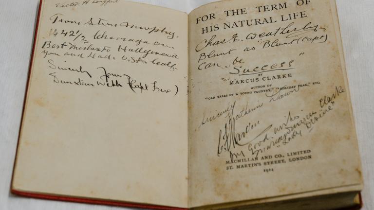 Inside cover of a copy of the novel For the Term of His Natural Life which has been autographed by people.
