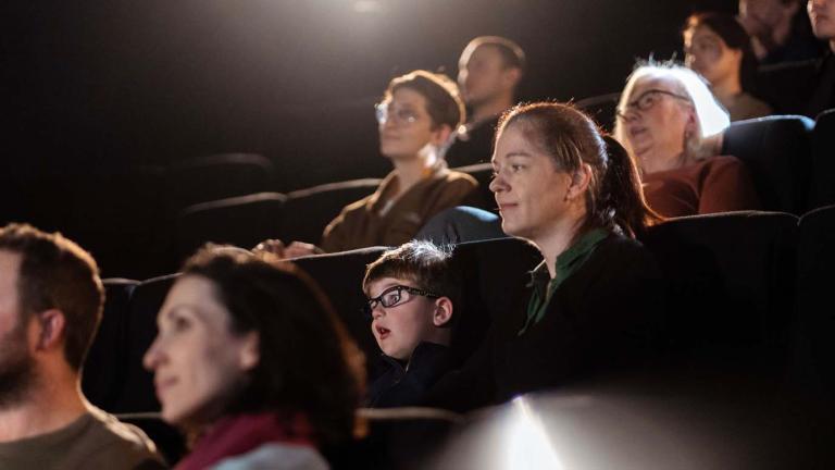 Audience members seated in Arc cinema