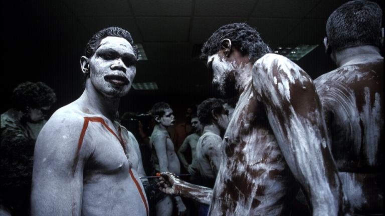 A group of Aboriginal men with their bodies painted for a ceremony.