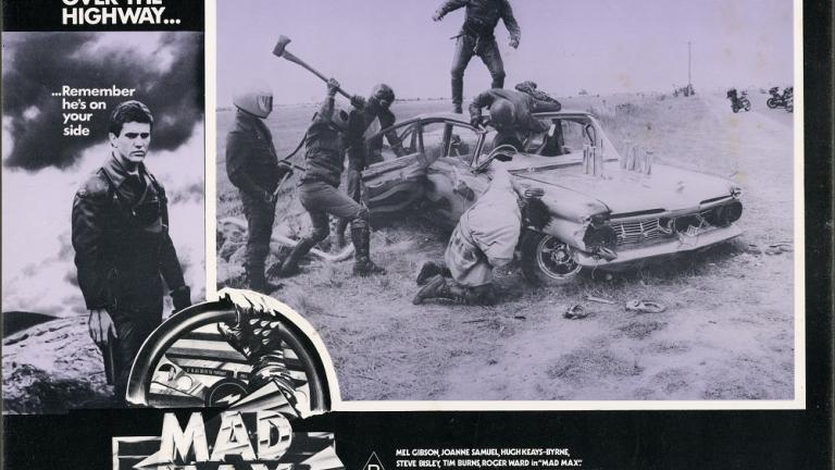 Lobby card for Max Max shows a gang attacking a car.