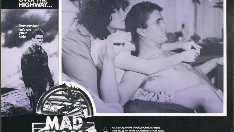 Lobby card for Mad Max shows Jess (Joanne Samuel) and Max (Mel Gibson).