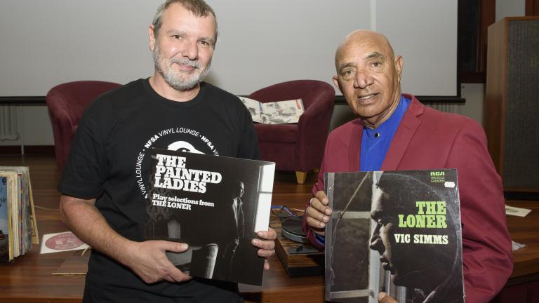 Sound curator Thorsten Kaeding and Vic Simms holding copies of Vic's records The Painted Ladies and The Loner