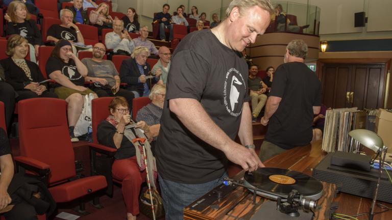 Senior Sound and Broadcast curator Rod Butler plays a record for the Vinyl Lounge audience