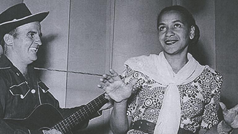 Black and white image of 50s jazz and blues singer Georgia Lee pictured with unknown guitarist