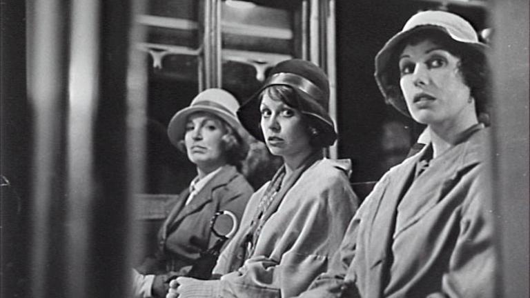 Film still from Caddie with Jacki Weaver as Josie and Helen Morse as Caddie traveling on a train with another person.