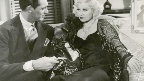 Cary Grant and Mae West exchange a look in a still from the film I'm No Angel, 1933.