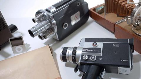 A variety of vintage camera and an ipod are displayed