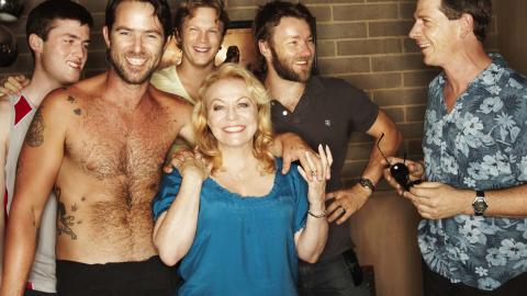 Jacki Weaver and the cast of the film Animal Kingdom laughing together on set