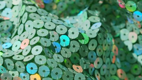 Close up of some green sequinned fabric.