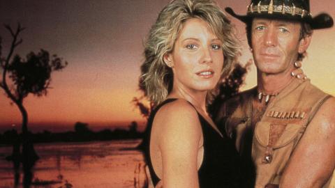 Paul Hogan as Mick Dundee and Linda Kozlowski as Sue Charlton in a cocktail party scene from Crocodile Dundee